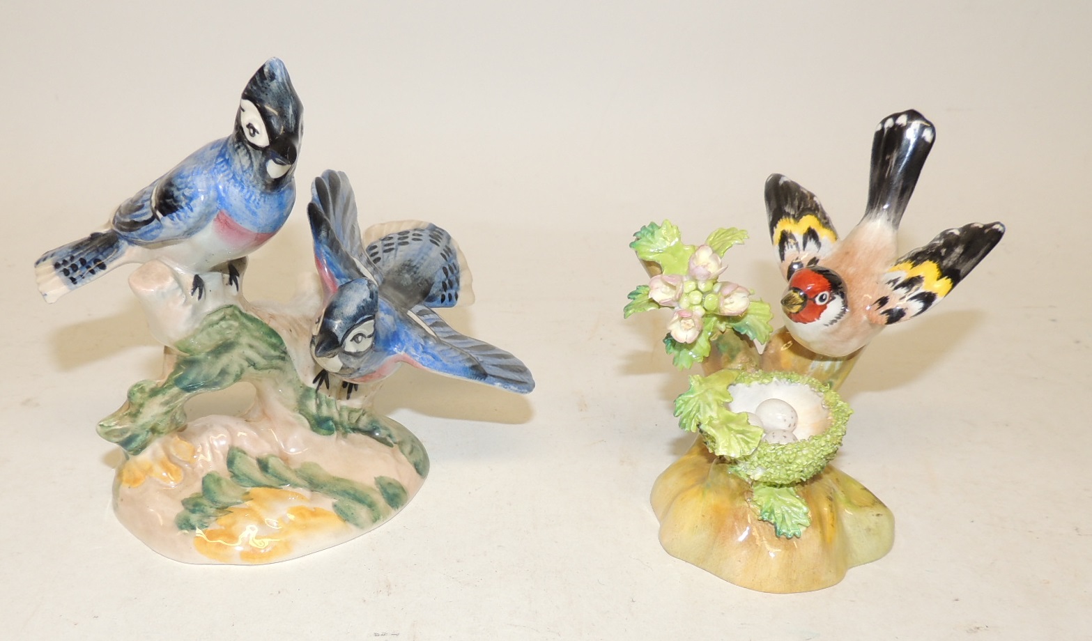 A Crown Staffordshire Porcelain Figure Of A Goldfinch And Nest Modelled 