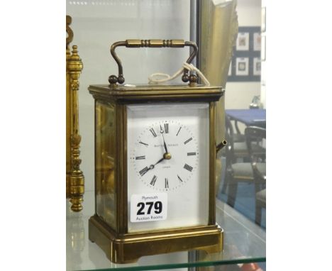 A brass cased carriage clock, Matthew Norman, London, striking on a gong with key, 18cm handle up.