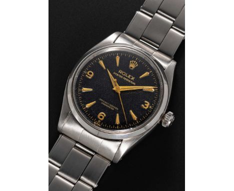 A RARE GENTLEMAN'S STAINLESS STEEL ROLEX OYSTER PERPETUAL BRACELET WATCHCIRCA 1956, REF. 6564 WITH BLACK "HONEYCOMB" 3-6-9 "E