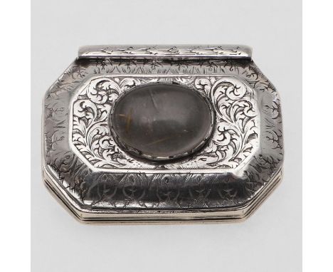 with reeded sides, the hinged cover with foliate decoration and with a clear cabochon-set boss, the base engraved with putti 