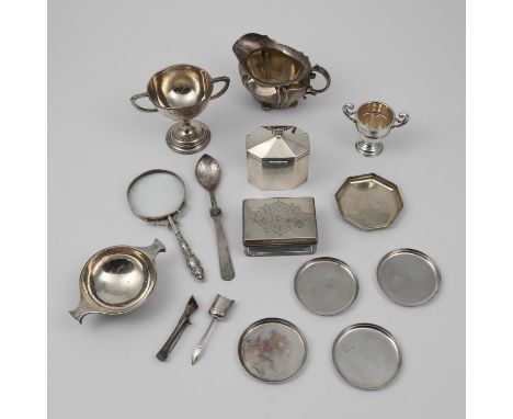 two small trophy cups (one inscribed), a small quaich, crested, a milk jug, an octagonal tea caddy, a mounted rectangular toi