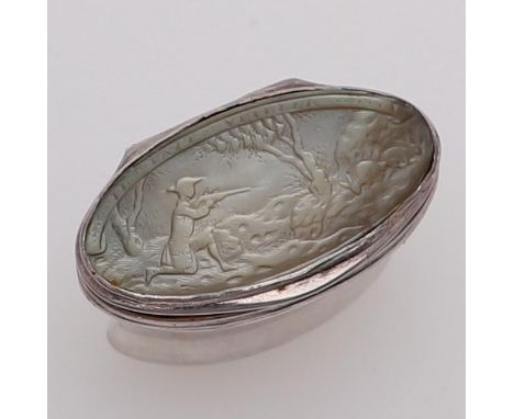 of waisted oval form, the hinged cover carved in low relief with a hunting scene below the inscription "IL FAUT VELLIER", the