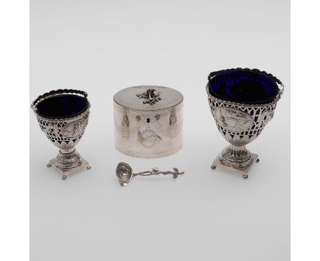 comprising of a swing-handle sugar basket, blue glass liner, by Thomas Daniell, London c.1775, an oval tea caddy, with a flow
