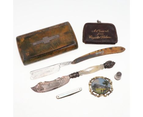 a group of souvenirs comprising, a butter knife with an engraved blade, by George Unite 1850, a razor, thimble, penknife, pur