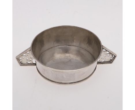 of circular tapering form, with pierced twin handles   formed with rabbit motifs, by Tessara M Harley, London 1934; 4.5" (11.