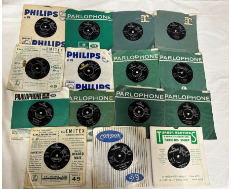 The Beatles a collection of fifteen Parlophone 45's to include Can't buy me love x3 I want to hold your hand x2 Twist and sho