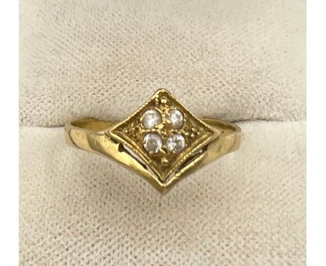 An 14 carat ring set with diamonds. Size R. Weight 2gm. 