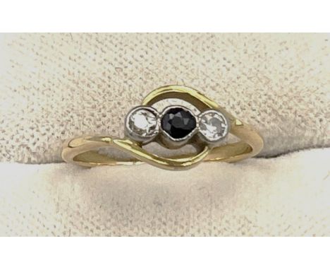 An unmarked yellow metal ring set with sapphire and two diamonds. Size H/I, weight 1.6gm. 