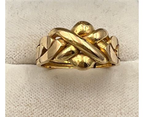 A yellow metal ring, tests as 18 carat gold. Size O. Weight 5.5gm. 