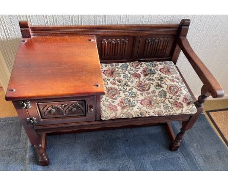 An Old Charm oak telephone table with seat and cupboard to the side. 93cm l x 47cm d x 74cm h. 