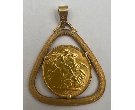 A Victorian 1887 full gold sovereign set in an 18 carat yellow gold mount on suspension ring. Total weight 14.1gm. 