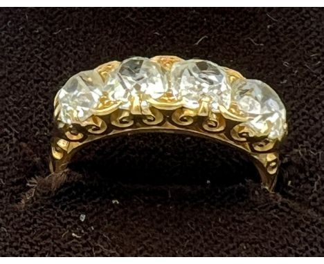 A Victorian 18 carat gold ring set with four old cut diamonds. Total weight of diamonds approximately 2.25 carats. Clarity S1