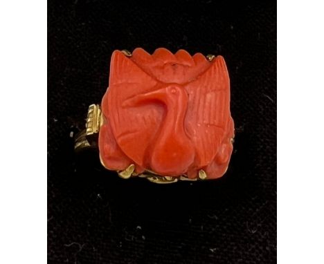 A Chinese 14 carat yellow gold ring set with carved coral bird. Size M, weight 6.1gm. 