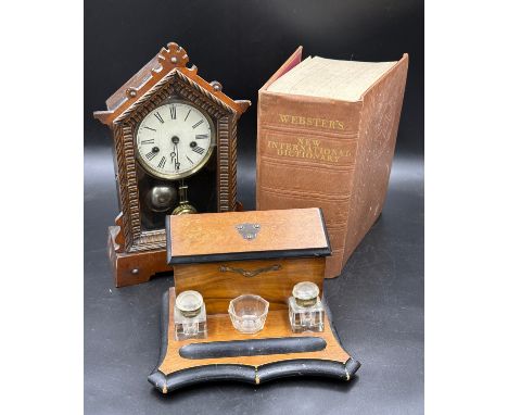A miscellany to include a 19thC stationary box with inkwells, a 19thC mantle clock 38cm h and Webster's New International Dic