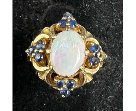 A 9ct gold cluster ring set with central opal and sapphires 535gms, size P/Q. 