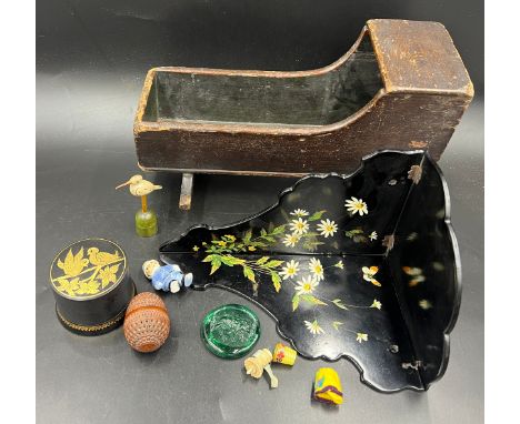 An interesting miscellany to include a 19thC doll’s cradle, lacquer box, 19thC papier mâché corner shelf, glass seal with wil