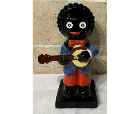 A Carlton Ware Golly figure playing a banjo No. 2/250, 20cm h. This item is listed on the basis they are illustrative of a by