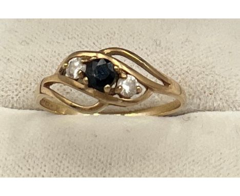 A 9 carat gold ring set with blue and clear stones. Size Q. Weight 1.5gm. 