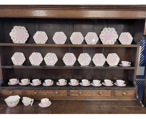 A Wileman &amp; Co. Foley china tea service comprising 12 cups, 12 saucers, 12 plates, 2 bread and butter plates and a milk j