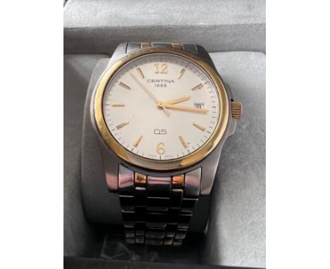 A Certina DS battery operated wristwatch with date aperture on gold and silver coloured bracelet. In box, with user manual an