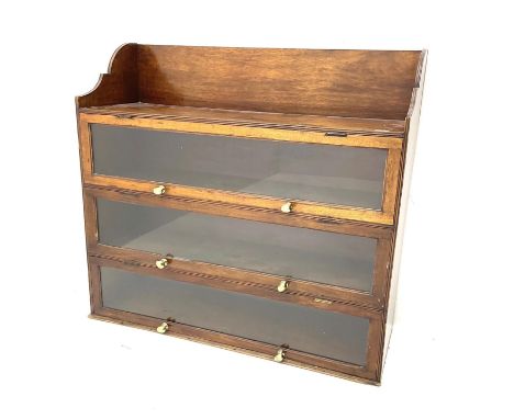 A 19thC mahogany bookcase with three hinged glass sections and shelf to top. 100 h x 107 w x 37cm d. 