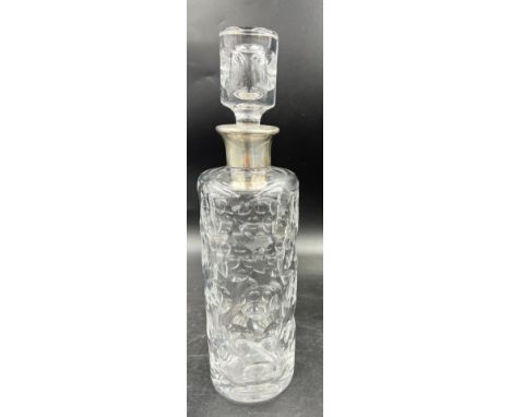 A glass decanter with hallmarked Dutch silver top. 33cm h. 