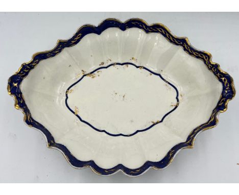 A Worcester porcelain dessert dish of the Flight Period (1783-92) Hand painted underglaze blue with gilt decoration and blue 