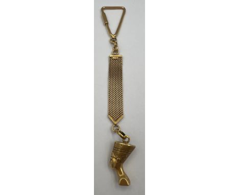 An 18 carat gold key ring with Egyptian head charm, weight 18.1gm. 14cm l. 