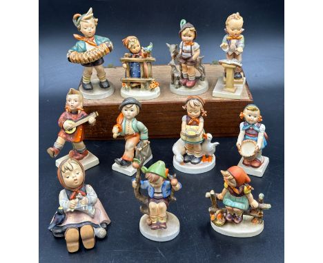 A quantity of Goebel Hummel figures, to include 129 Band Leader, 185 Accordion Boy, 86 Happiness, 69 Happy Pastime, 200 Littl