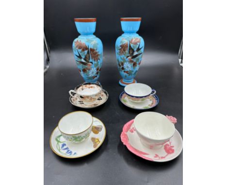 Four 19thC cups and saucers to include two with lozenge marks to base, a Minton with butterfly handle and one with pink flora