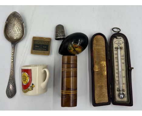 A miscellaneous lot to include a miniature leather cased thermometer, hallmarked silver preserve spoon, Arcadian China Hull m