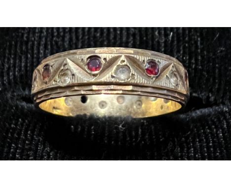 A 9 carat gold eternity ring set with pink and clear stones. Size L, weight 2.2gm. 
