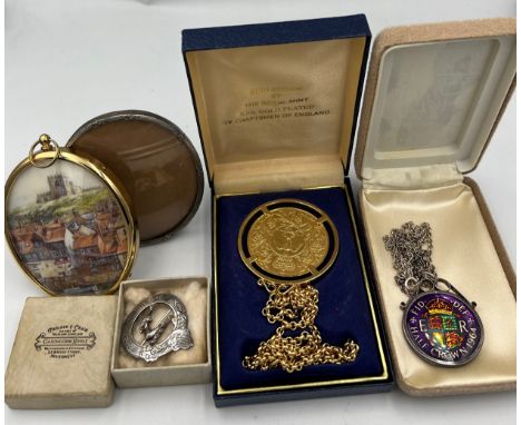 A miscellany to include Scottish silver brooch,”Fortis in Arduis”, Royal Mint 22 carat gold plated crown, 1964 half crown and