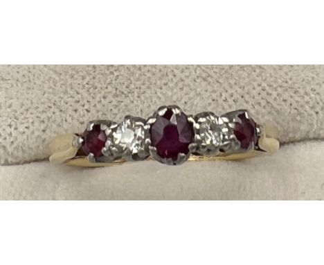 An 18 carat and platinum ring set with diamonds and rubies. Size J/K. Weight 2.3gm. 