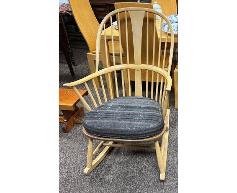 Ercol ‘Chairmaker’ rocking chair with gold lable and original cushions. 104cm h to back. 