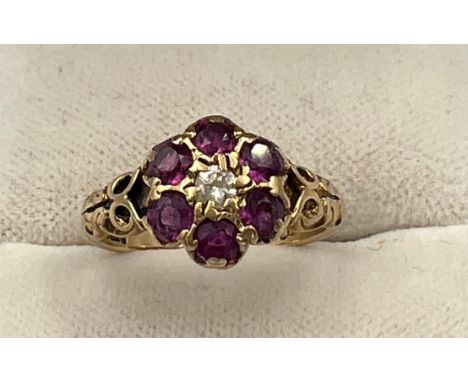 A 9 carat gold ring set with pink and clear stones, size J, weight 2.4gm. 