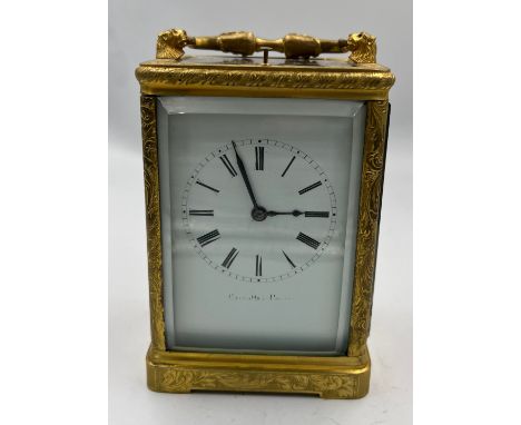 A 19thC brass cased carriage clock by Berrolla Paris. White enamel dial. Striking on a bell and having repeater movement. 12.