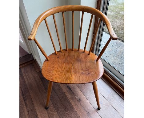 An Ercol blonde carver chair. 