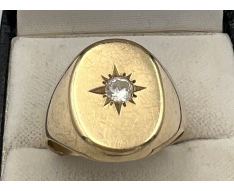 A 9 carat gold ring set with clear stone. Size V/W. Weight 4.8gm. 