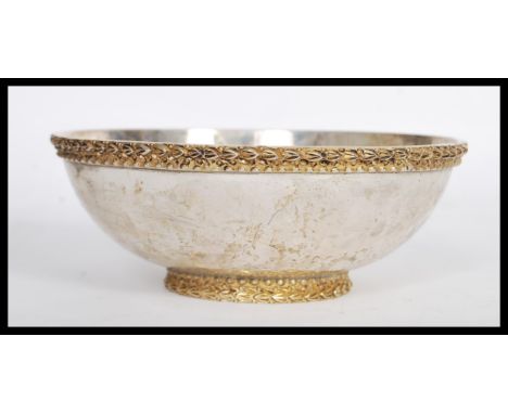 A sterling silver 925 stamped centerpiece bowl raised on an embossed gilded foot with decorative gadrooned border. Weighs 213