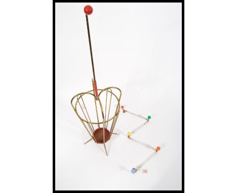Two vintage retro 20th Century sputnik atomic style items to include a W coat hook with colored ball finial ends and a brass 