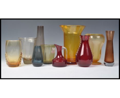 A good collection of vintage retro 20th Century studio art glass to include Whitefriars ruby red beaked jug with clear handle