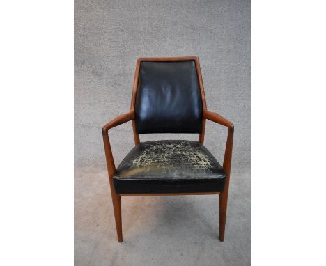 A mid 20th century vintage Danish teak framed armchair in leather upholstery. H.90x68cm 