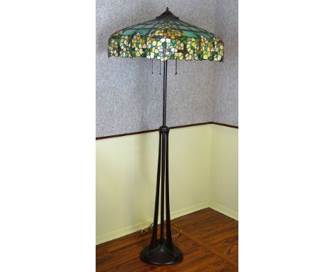 American Handel Floor Lamp. The lamp features a large four-sided stained glass shade designed with a continuous dogwood patte