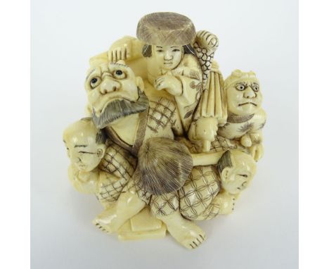 Early 20th Century Japanese Carved Netsuke of 5 Figures in a Pile. Signed with artists signature on bottom. Good condition. M