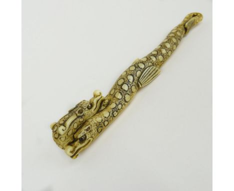 Early 20th Century Japanese Baisho Shop Carved Sashi Netsuke In The Form of a Dragon. Finely Incised. Signed with artist's si
