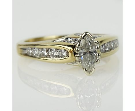 Lady's Approx. .31 Carat Marquise Cut Diamond and 14 Karat Yellow Gold Engagement Ring. Diamond J-K color, SI clarity. Signed