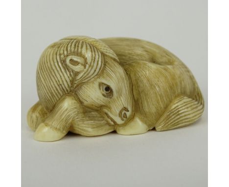 19/20th Century Japanese Carved Netsuke In The Form of a Recumbent Water Buffalo. Finely Incised. Signed with artist's signat