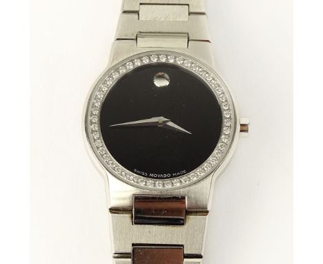 Lady's Vintage Movado Swiss Quartz Movement Watch with Diamond Bezel. Surface scratches to stainless steel otherwise good con