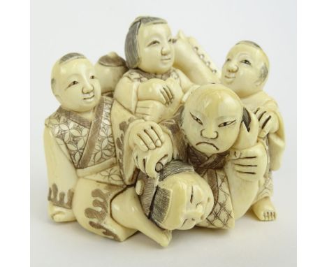 Early 20th Century Japanese Carved Netsuke of 5 Figures in a Pile. Signed with artists signature on bottom. Good condition. M
